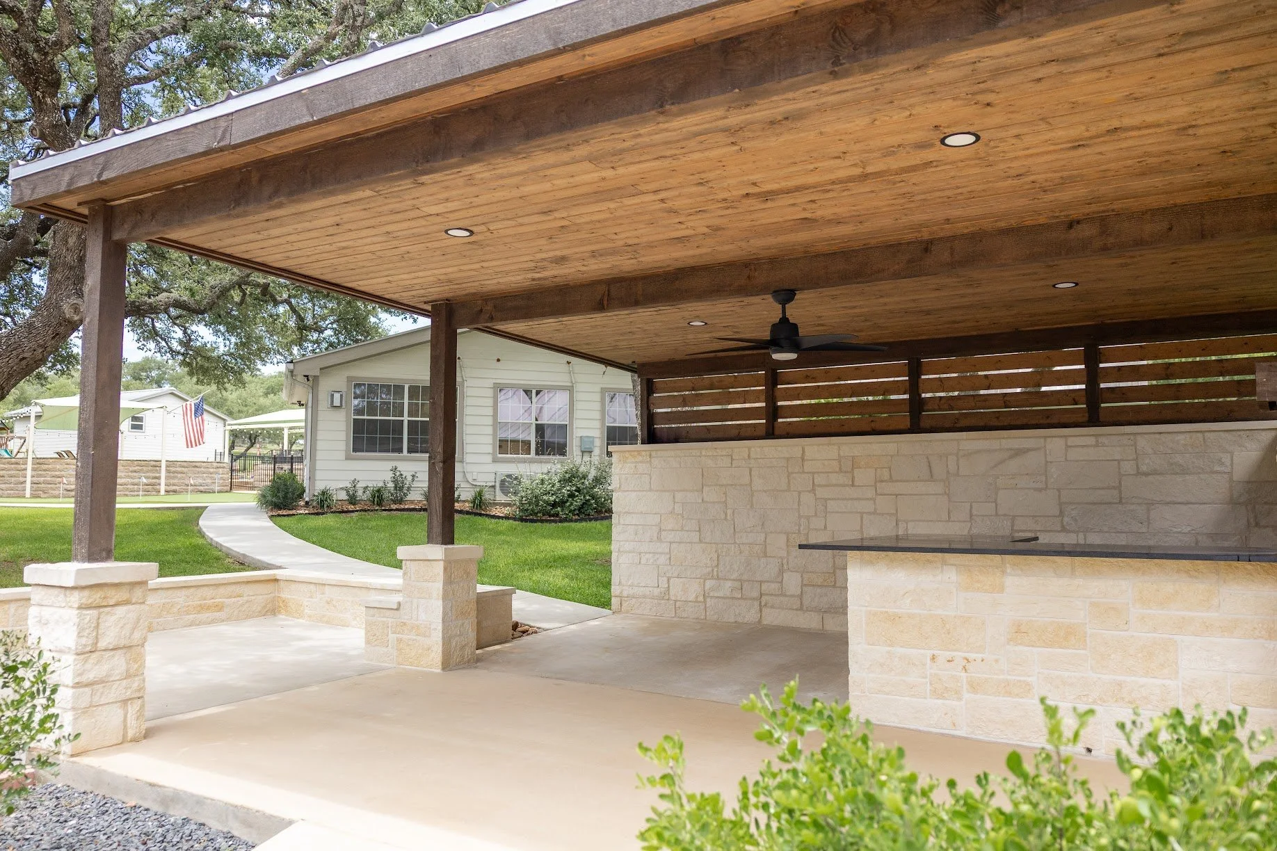 The outdoor bar with brick pillars and a wooden roof
